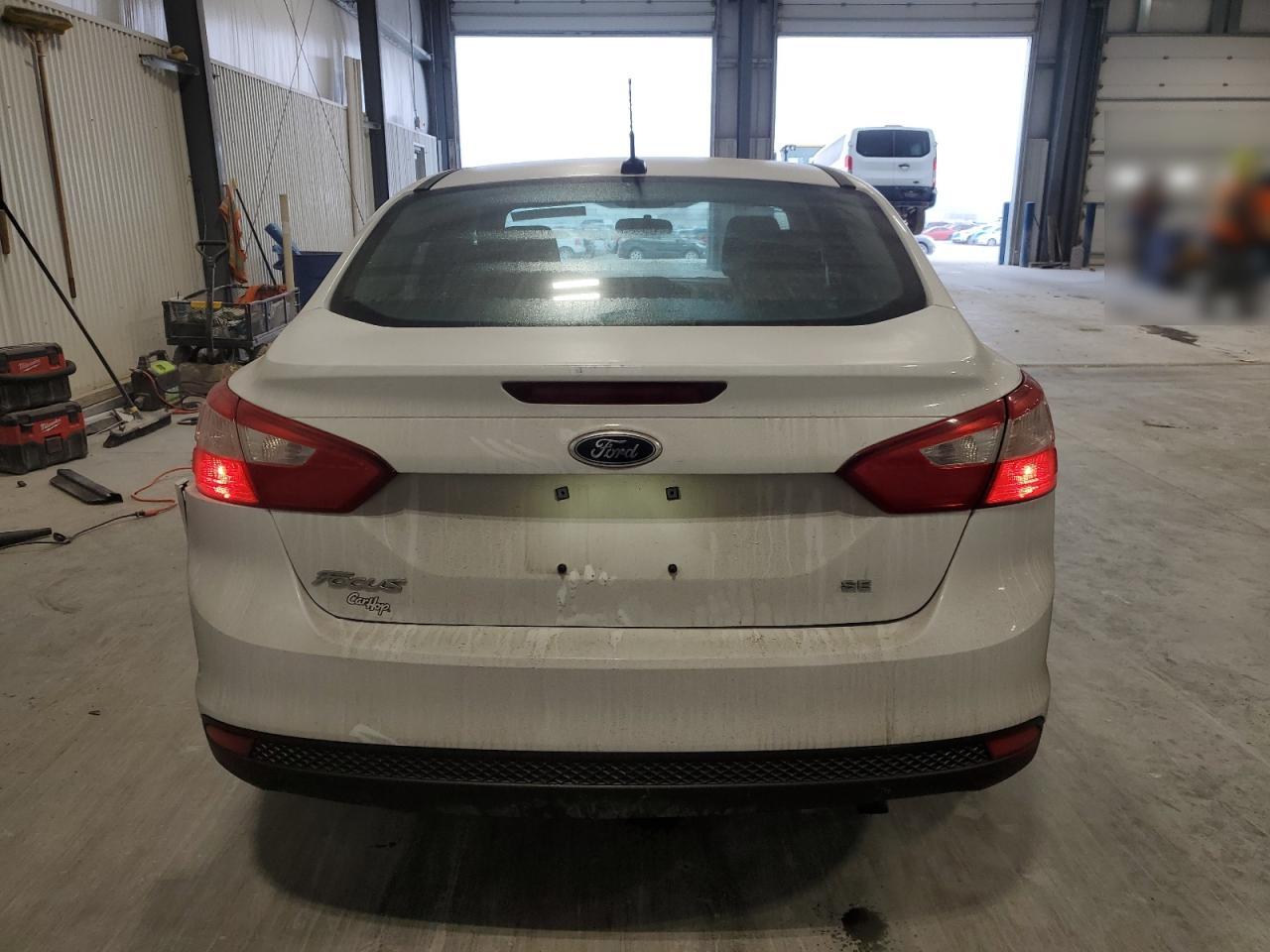 2012 Ford Focus VIN 1FAHP3F2XCL280057 Copart auction photo, undercarriage / side damage thumbnail 6