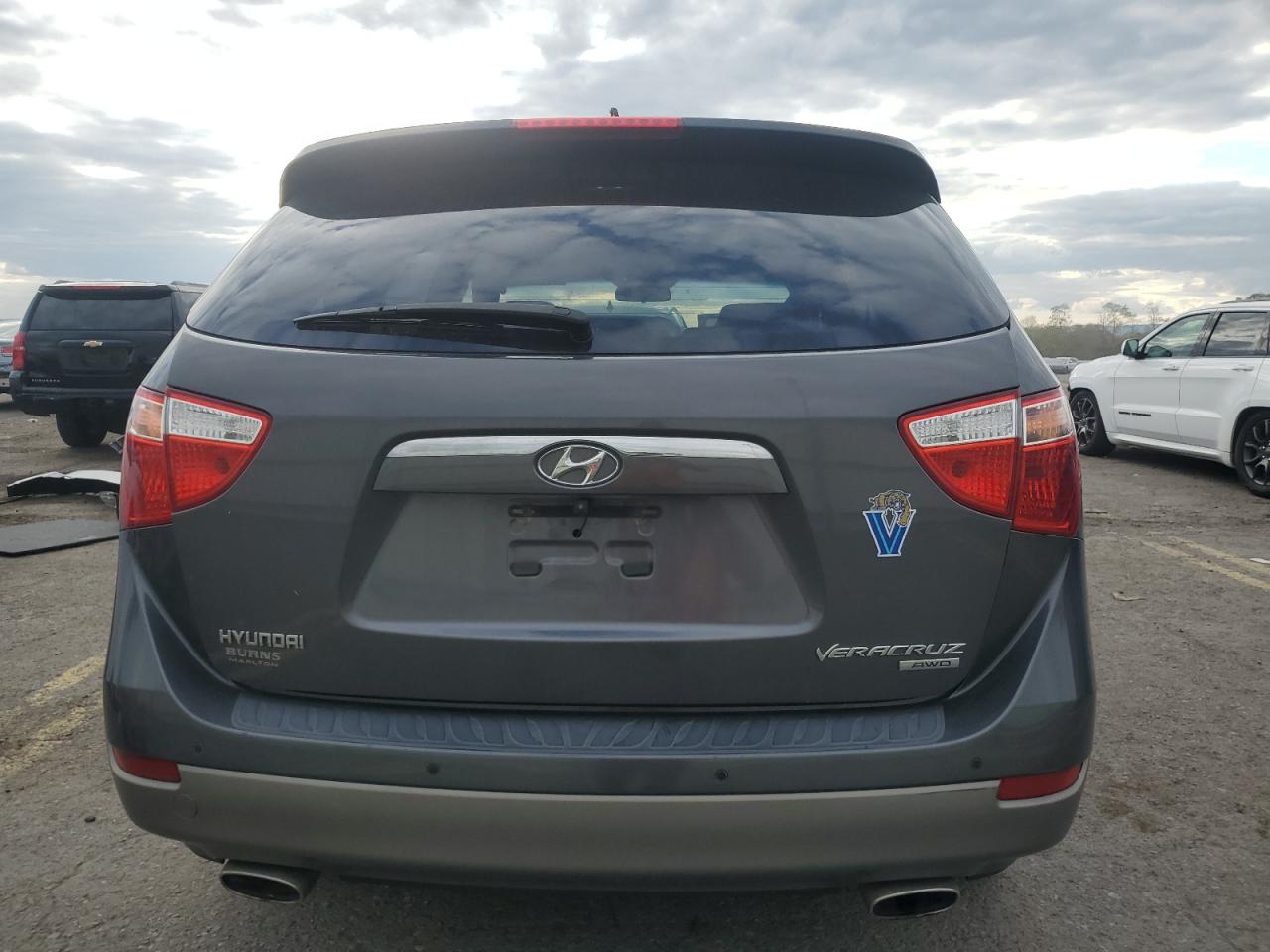2010 Hyundai Veracruz VIN KM8NUDCC3AU135339 Copart auction photo, side / front end damage thumbnail 6