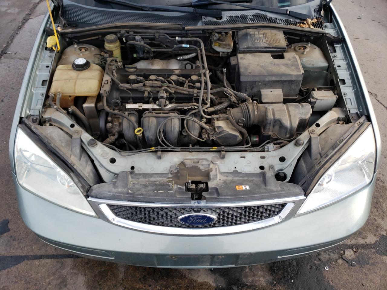 2005 Ford Focus VIN 3FAFP37N65R156999 Copart auction photo, rear end / hail damage thumbnail 11