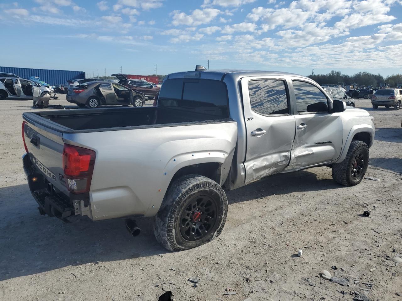 2021 Toyota Tacoma VIN 5TFAZ5CN5MX110649 Copart auction photo, side damage thumbnail 3