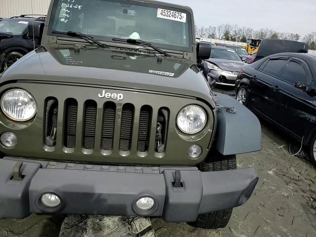 2015 Jeep Wrangler VIN 1C4AJWAGXFL581899 Copart auction photo, front end damage thumbnail 11