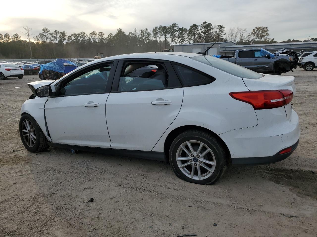 2015 Ford Focus VIN 1FADP3F25FL301853 Copart auction photo, all over damage thumbnail 2