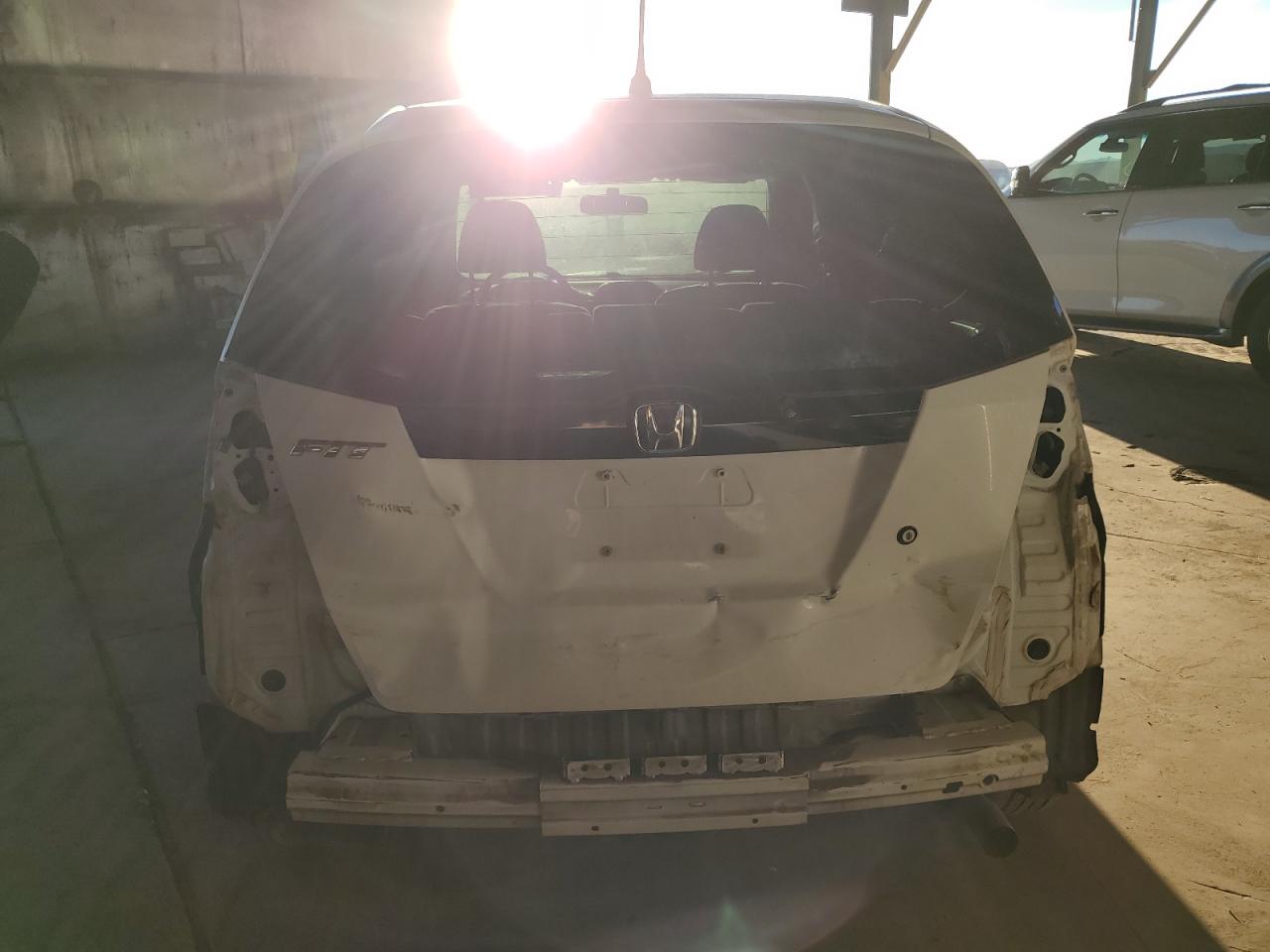 2009 Honda Fit VIN JHMGE882X9S073025 Copart auction photo, front end / rear end damage thumbnail 6