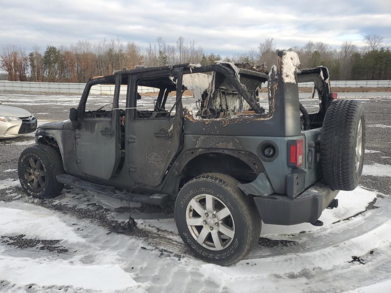 2015 Jeep Wrangler VIN 1C4BJWEGXFL714921 Copart auction photo, burn damage thumbnail 2