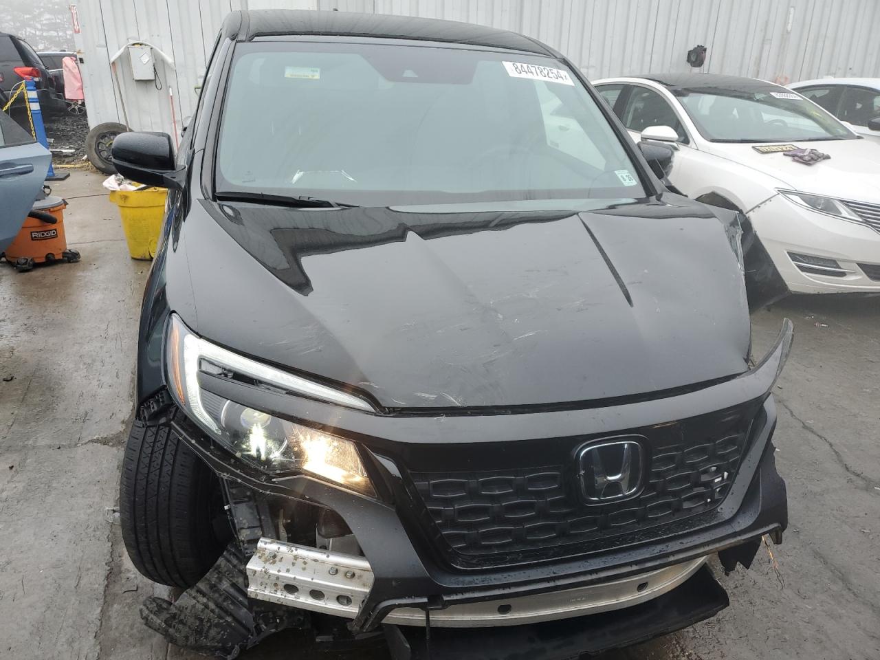 2021 Honda Passport VIN 5FNYF8H24MB032186 Copart auction photo, front end / minor dent/scratches damage thumbnail 5