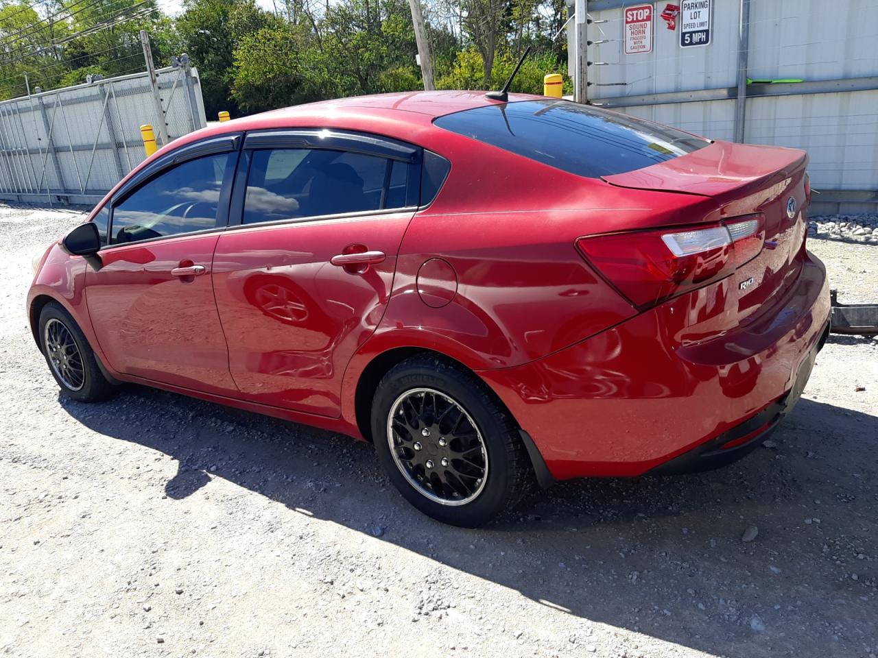 2015 KIA Rio VIN KNADN4A3XF6421830 Copart auction photo, rear end damage thumbnail 2
