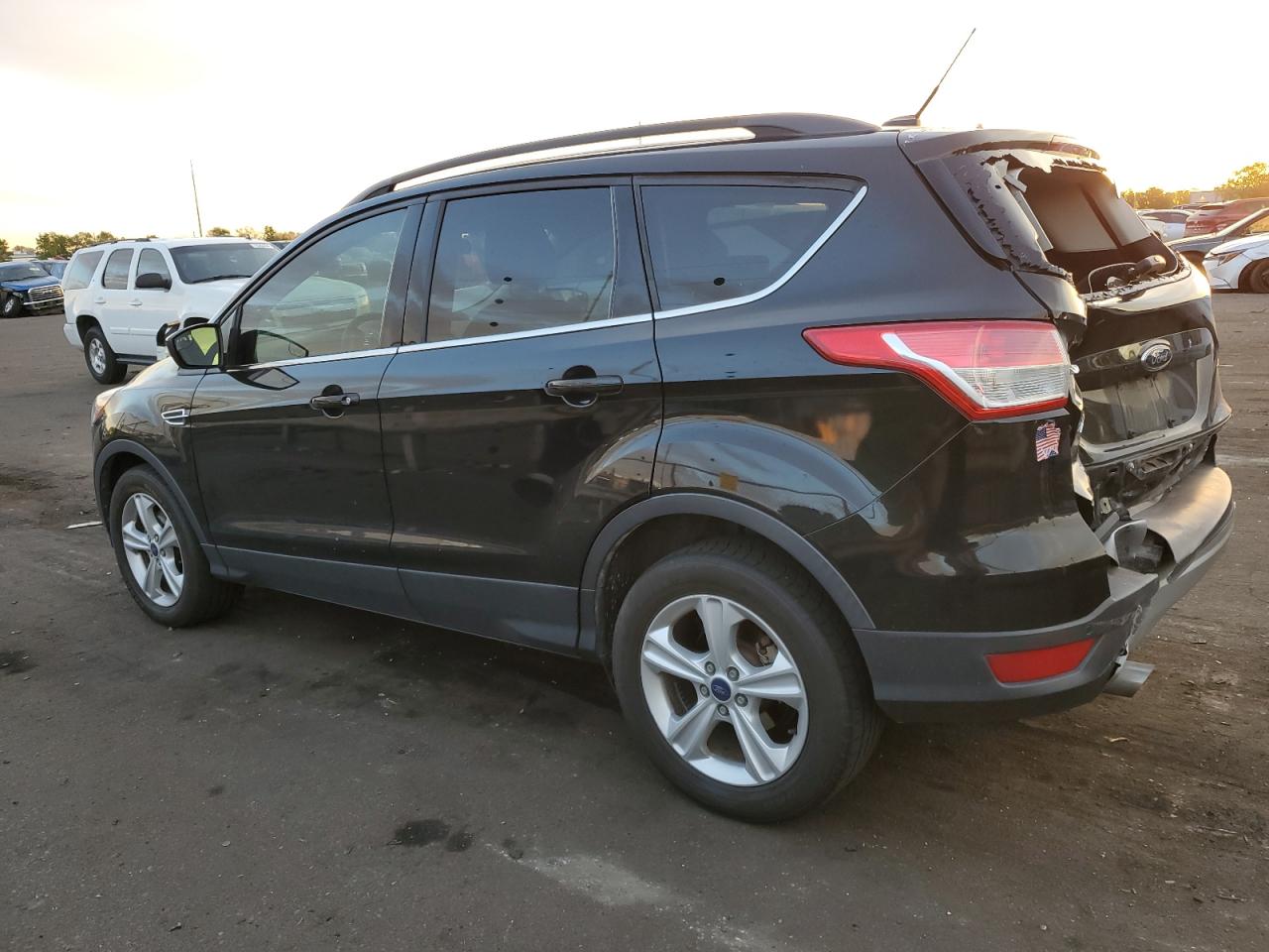 2016 Ford Escape VIN 1FMCU0GX1GUA09227 Copart auction photo, rear end / hail damage thumbnail 2