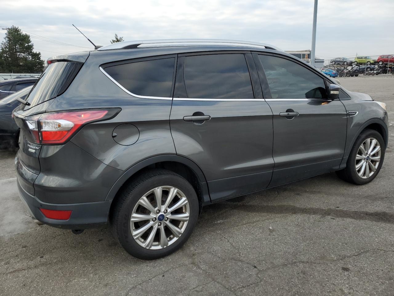 2017 Ford Escape VIN 1FMCU0J99HUA58123 Copart auction photo, side / front end damage thumbnail 3