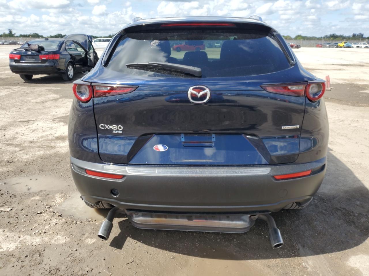 2024 Mazda CX-30 VIN 3MVDMBBM1RM660090 Copart auction photo, side / front end damage thumbnail 6