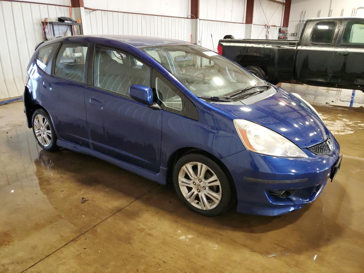 2009 Honda Fit VIN JHMGE88479S031302 Copart auction photo, side / rear end damage thumbnail 4
