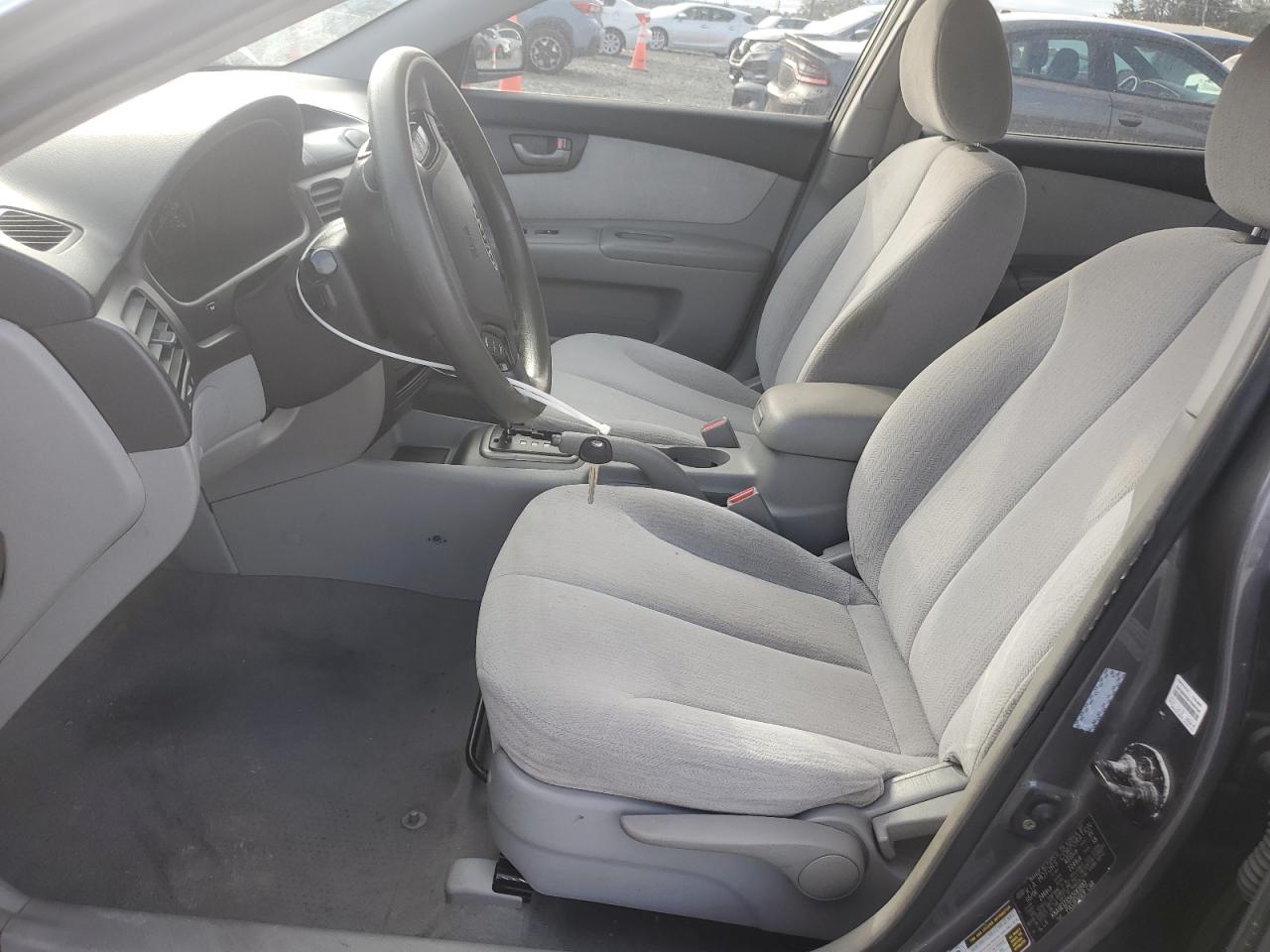 2006 KIA Optima VIN KNAGE123565061883 Copart auction photo, all over damage thumbnail 7