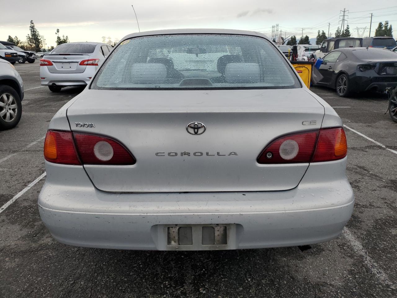 2001 Toyota Corolla VIN 1NXBR12E61Z451596 Copart auction photo, side / all over damage thumbnail 6