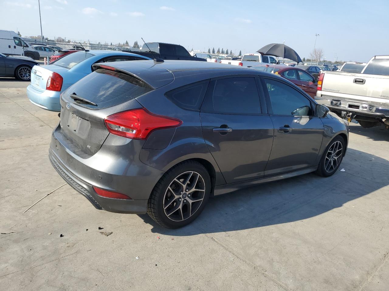 2015 Ford Focus VIN 1FADP3K2XFL306746 Copart auction photo, side / front end damage thumbnail 3