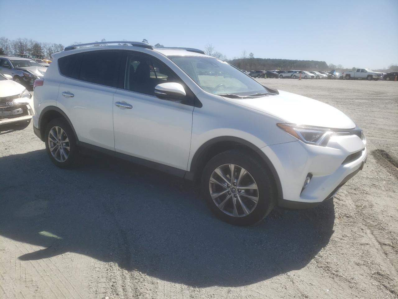 2016 Toyota RAV 4 VIN JTMDFREV9GJ058704 Copart auction photo, side / rear end damage thumbnail 4