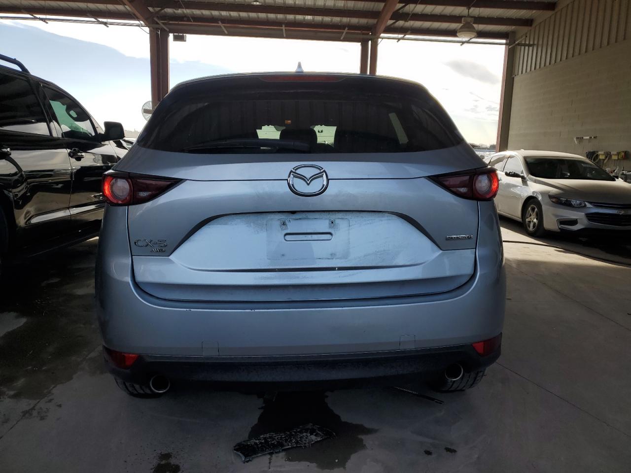 2021 Mazda CX-5 VIN JM3KFBCM8M0360762 Copart auction photo, side / front end damage thumbnail 6