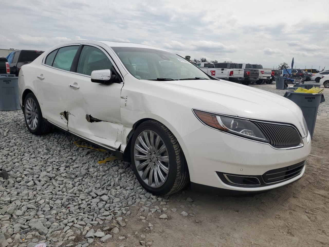 2014 Lincoln MKS VIN 1LNHL9EK7EG604504 Copart auction photo, all over damage thumbnail 4