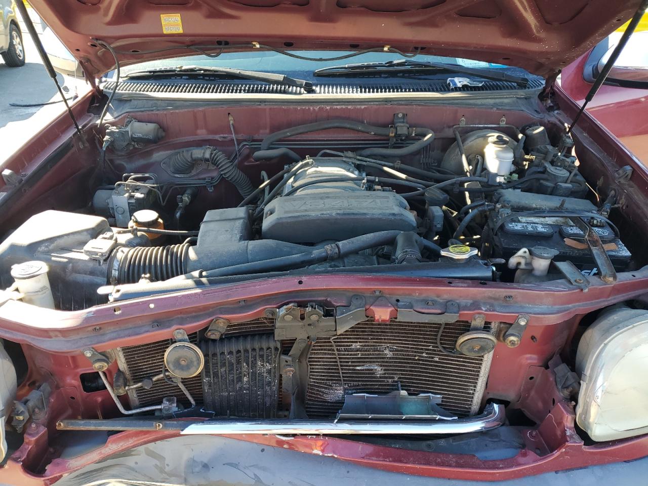 2000 Toyota Tundra VIN 5TBBT4410YS095297 Copart auction photo, front end / minor dent/scratches damage thumbnail 12