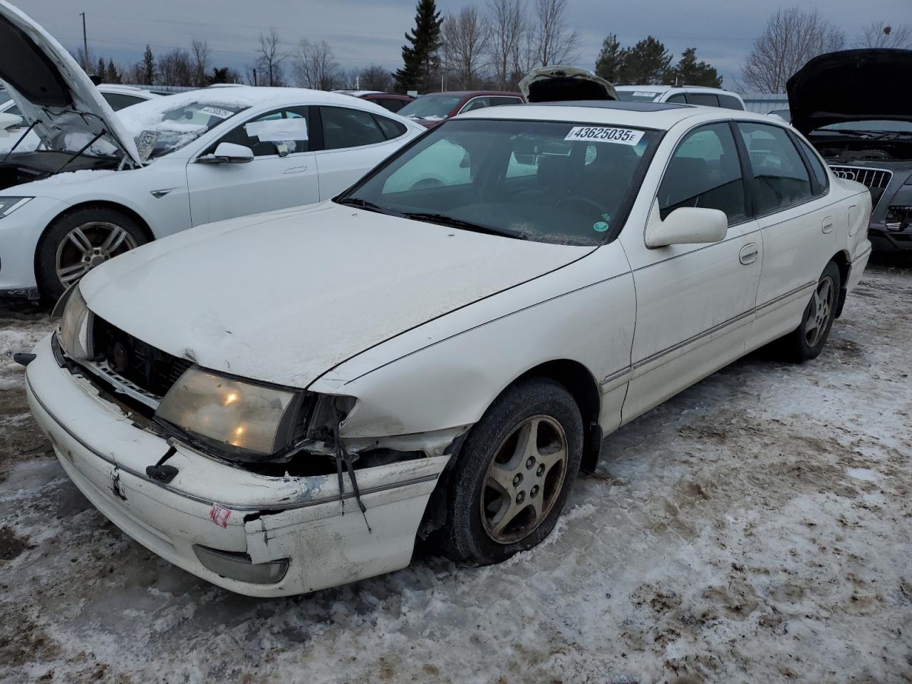 1999 Toyota Avalon VIN 4T1BF18B3XU297203 - Copart auction photo