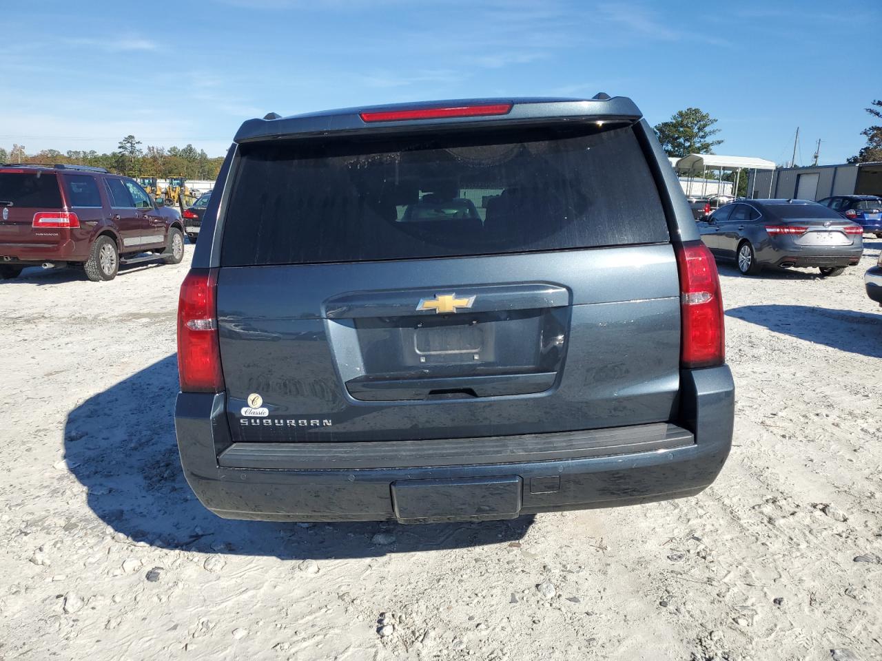 2019 Chevrolet Suburban VIN 1GNSKHKCXKR291296 Copart auction photo, side / front end damage thumbnail 6