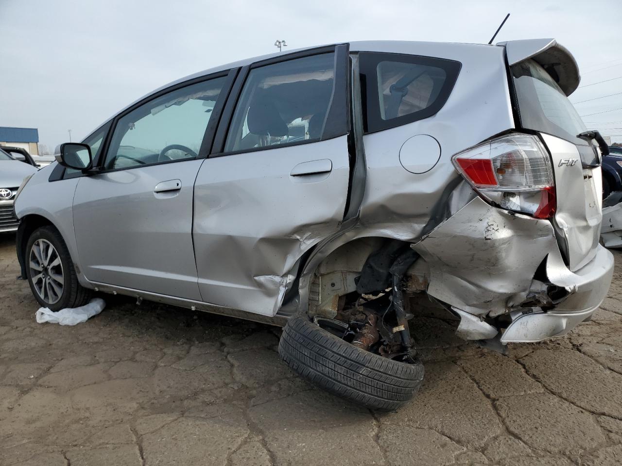 2012 Honda Fit VIN JHMGE8H57CS003385 Copart auction photo, all over damage thumbnail 2