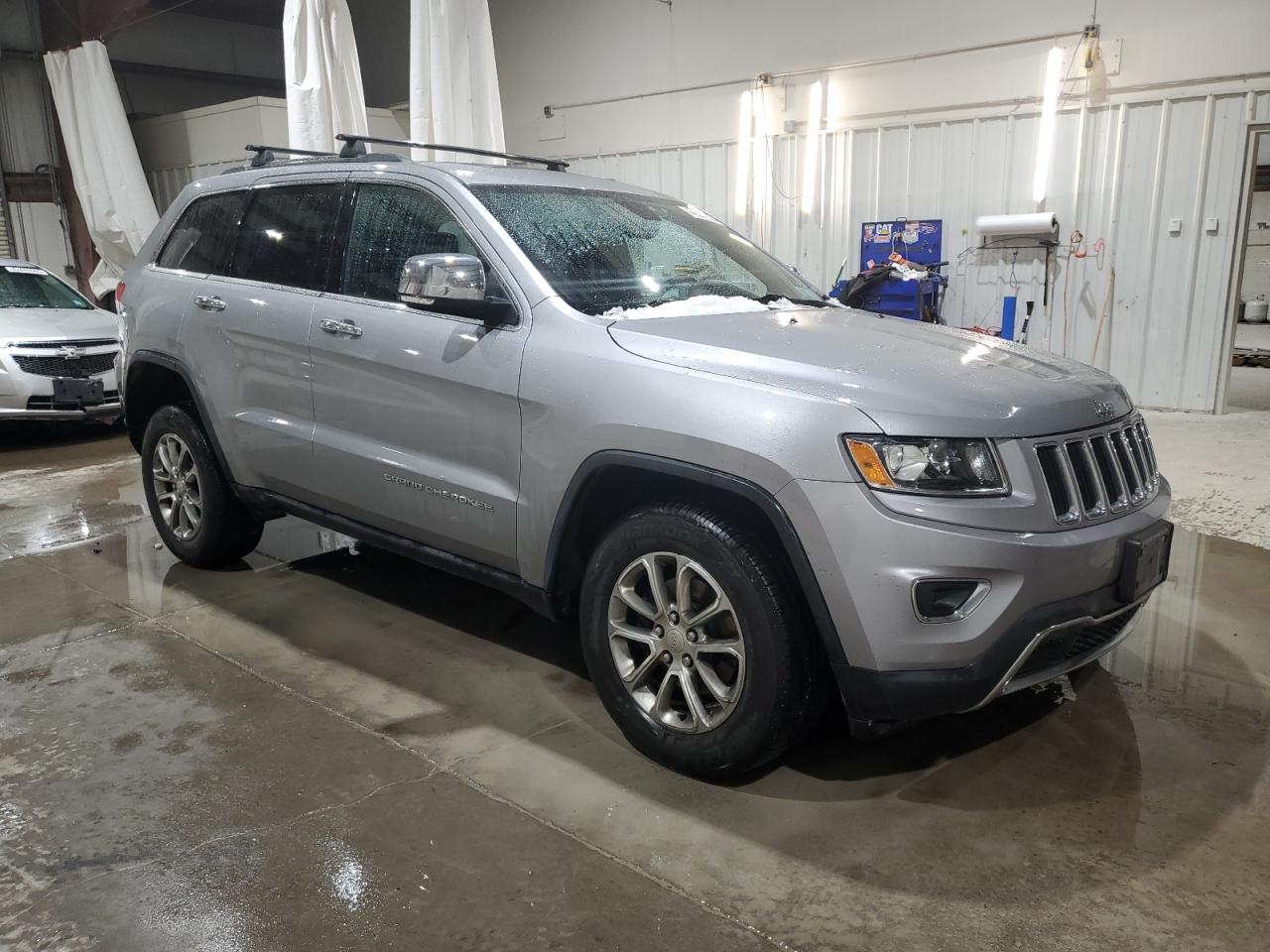 2014 Jeep Grand Cherokee VIN 1C4RJFBG6EC210836 Copart auction photo, front end / side damage thumbnail 4
