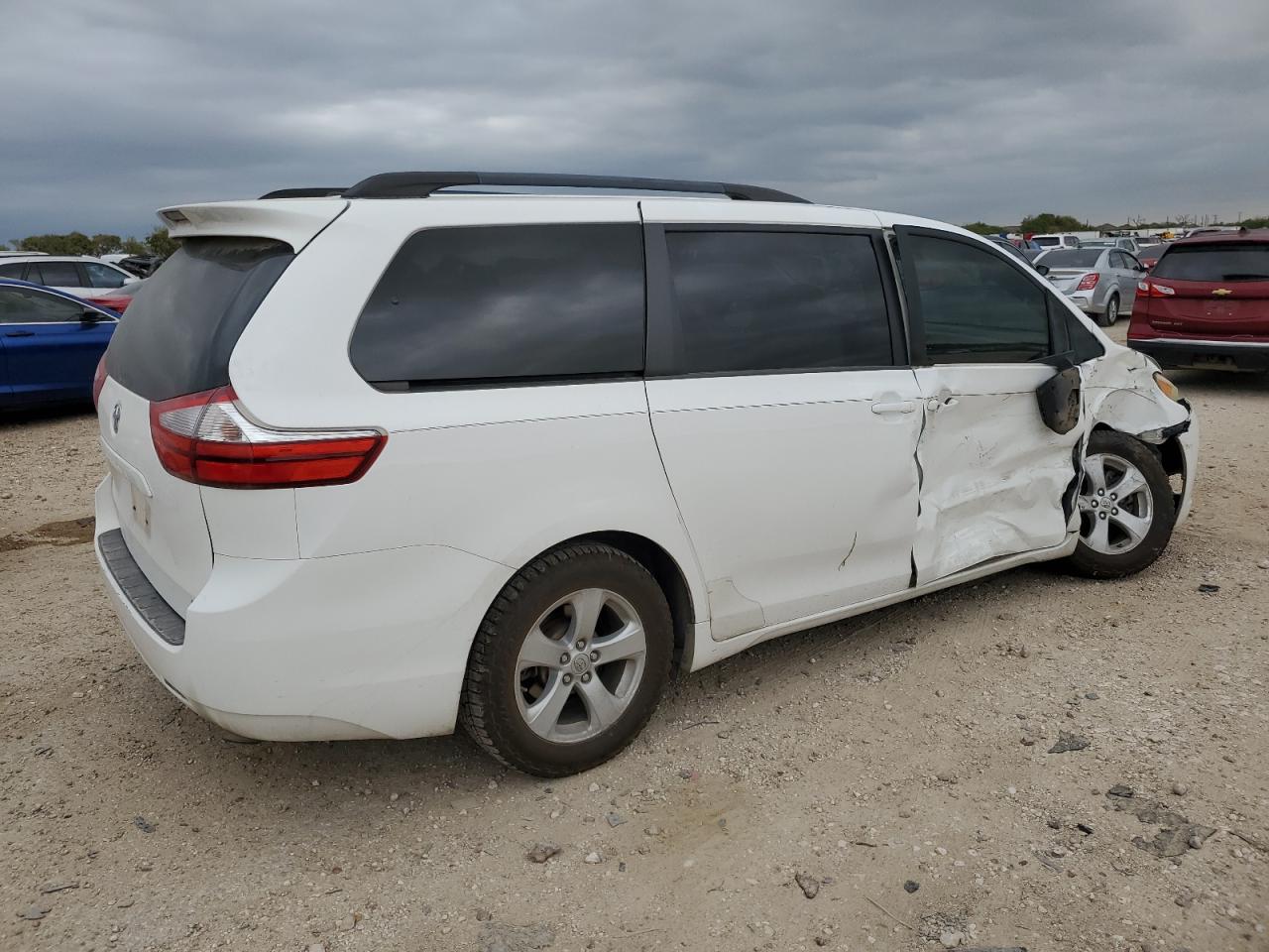 2015 Toyota Sienna VIN 5TDKK3DC0FS669769 Copart auction photo, side / front end damage thumbnail 3