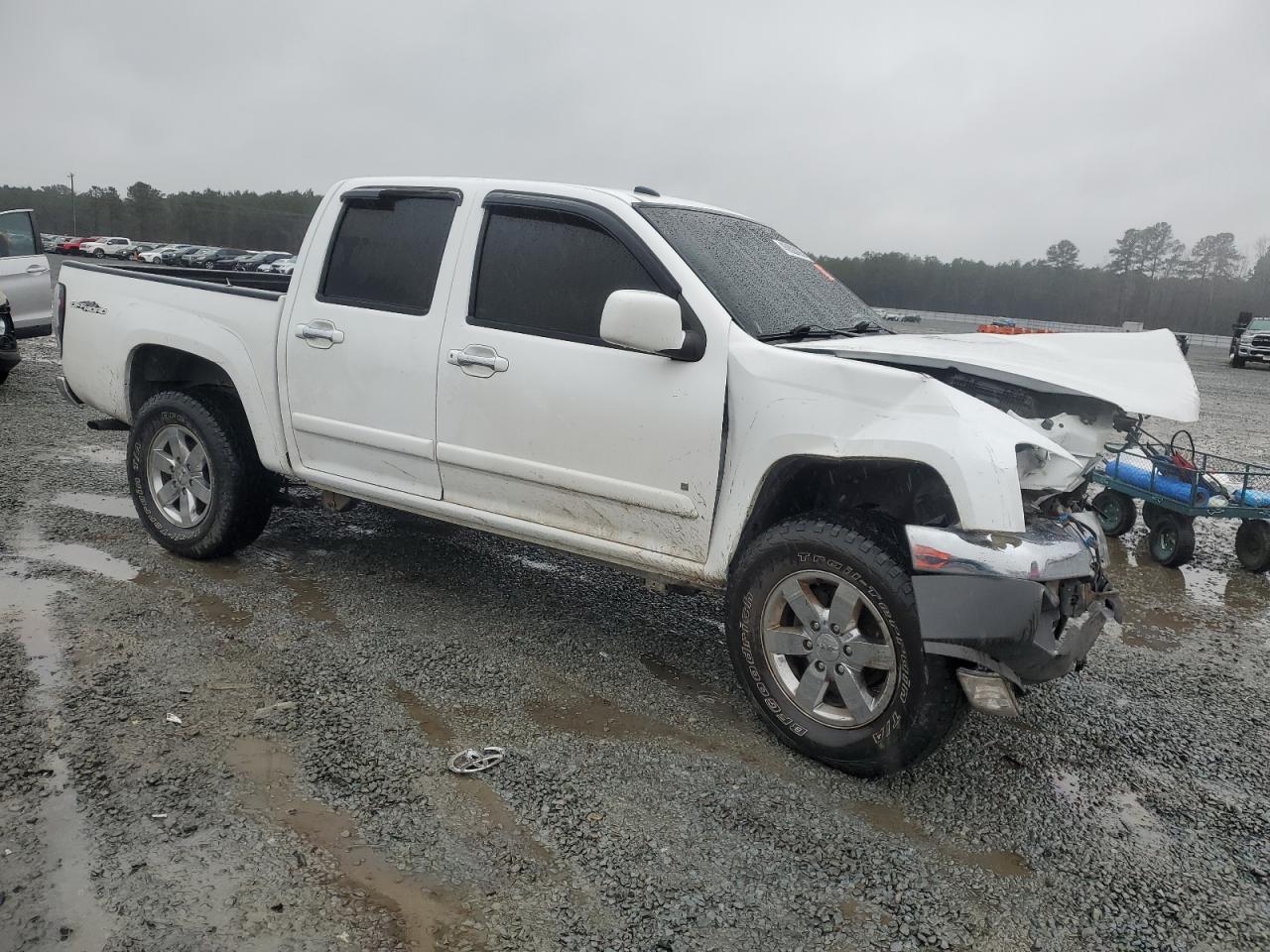 2009 GMC Canyon VIN 1GTDS13L798110159 Copart auction photo, front end / side damage thumbnail 4