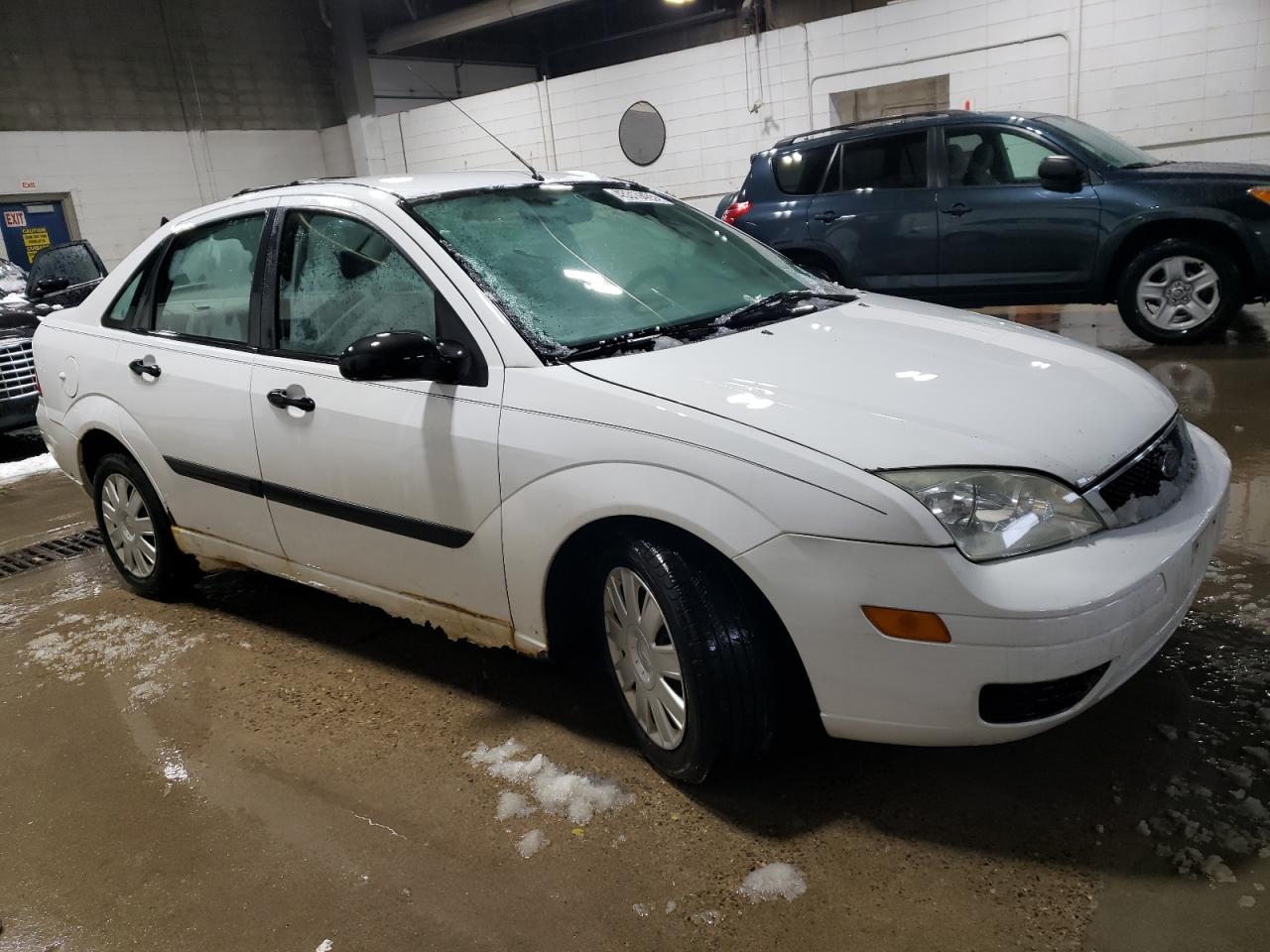2005 Ford Focus VIN 1FAFP34N15W119747 Copart auction photo, undercarriage / minor dent/scratches damage thumbnail 4