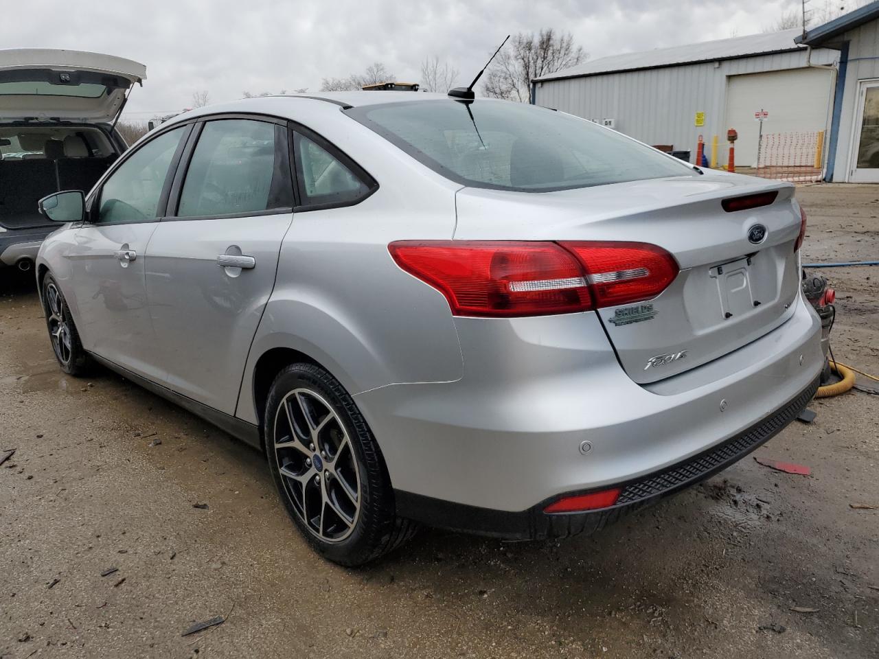 2018 Ford Focus VIN 1FADP3H28JL215443 Copart auction photo, rear end / minor dent/scratches damage thumbnail 2