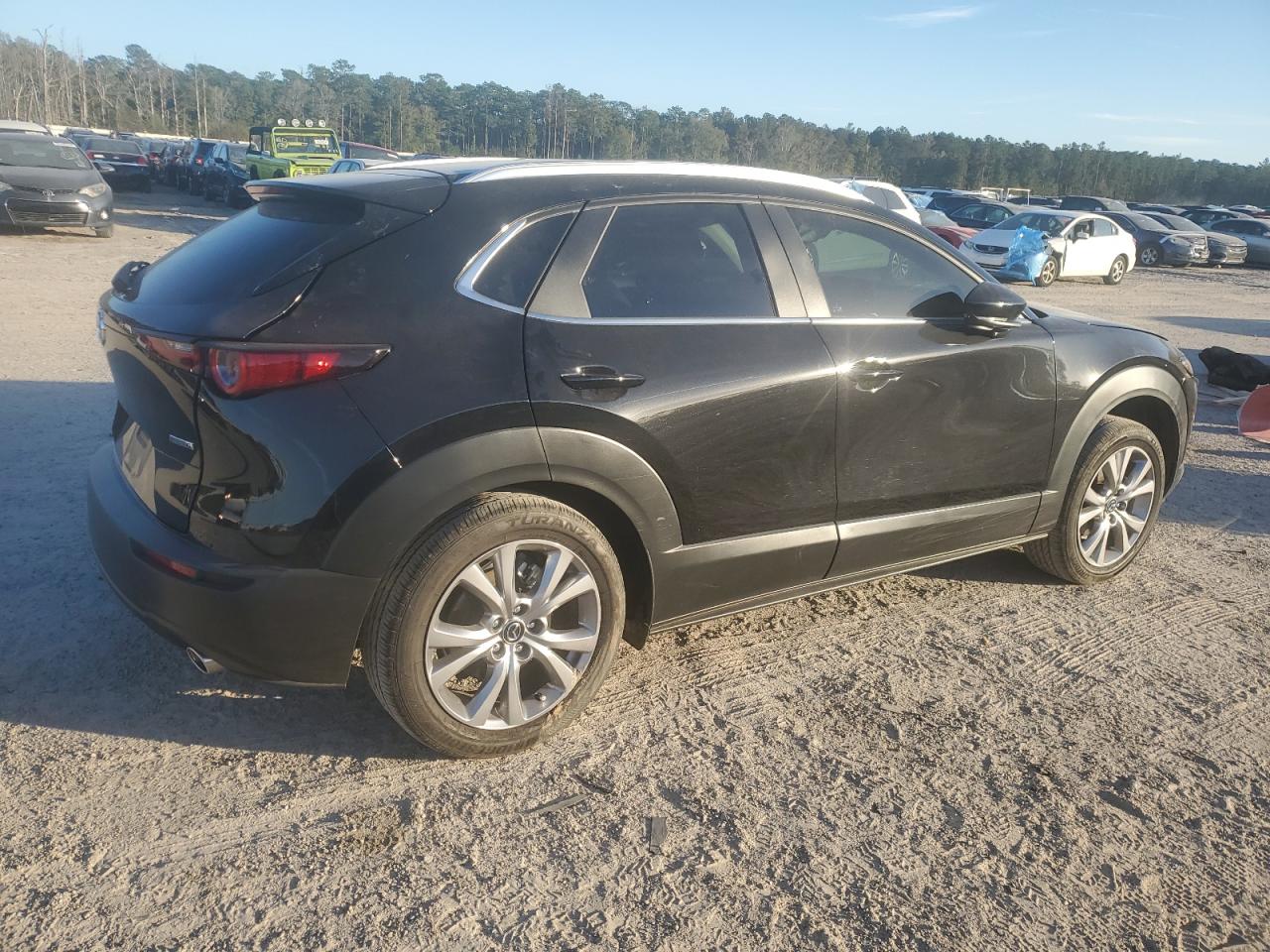 2023 Mazda CX-30 VIN 3MVDMBBM0PM569695 Copart auction photo, side / rear end damage thumbnail 3