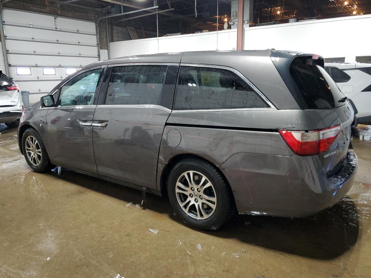 2012 Honda Odyssey VIN 5FNRL5H61CB086929 Copart auction photo, side / front end damage thumbnail 2