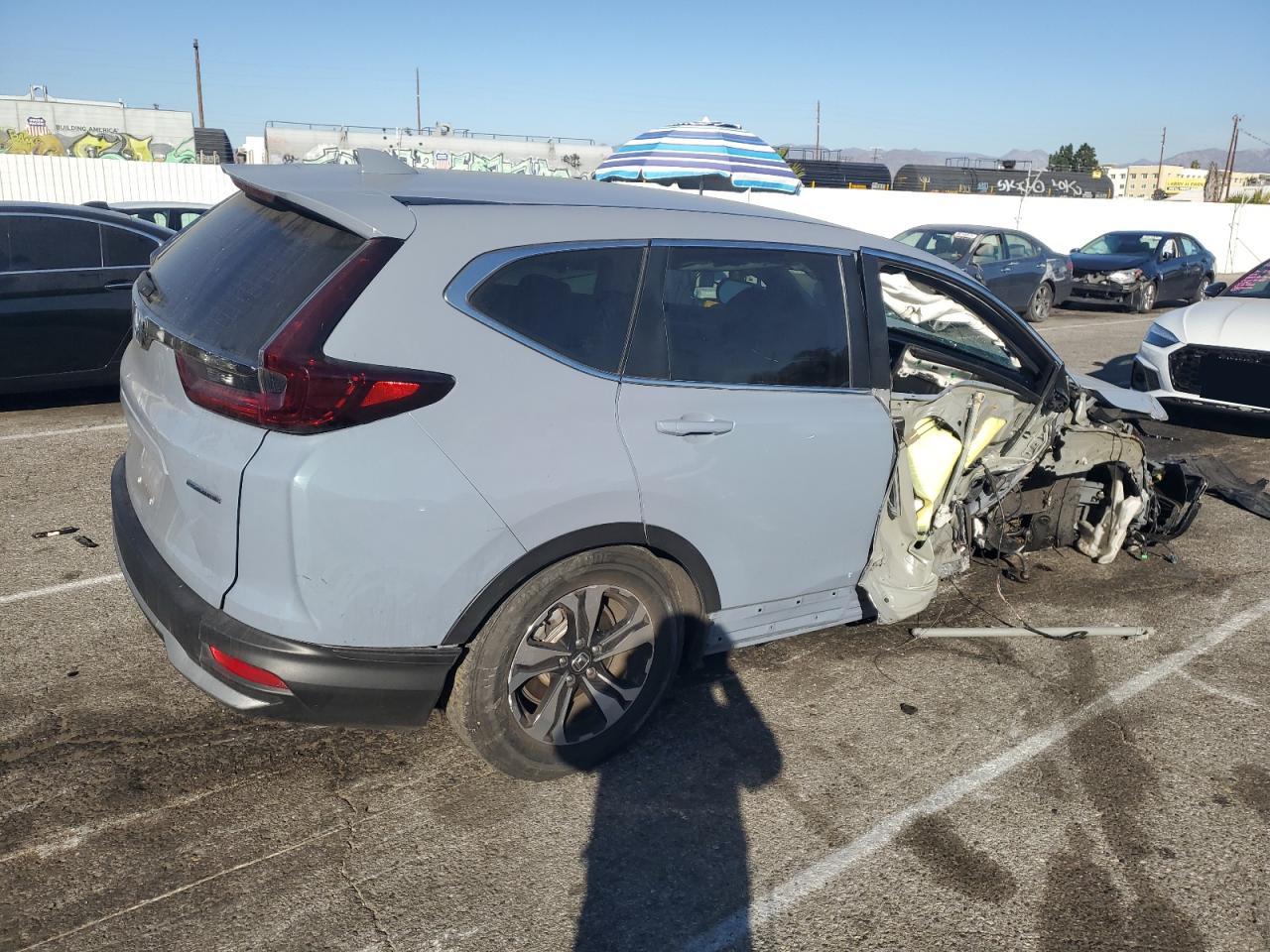 2022 Honda CR-V VIN 2HKRW1H74NH402711 Copart auction photo, side / front end damage thumbnail 3