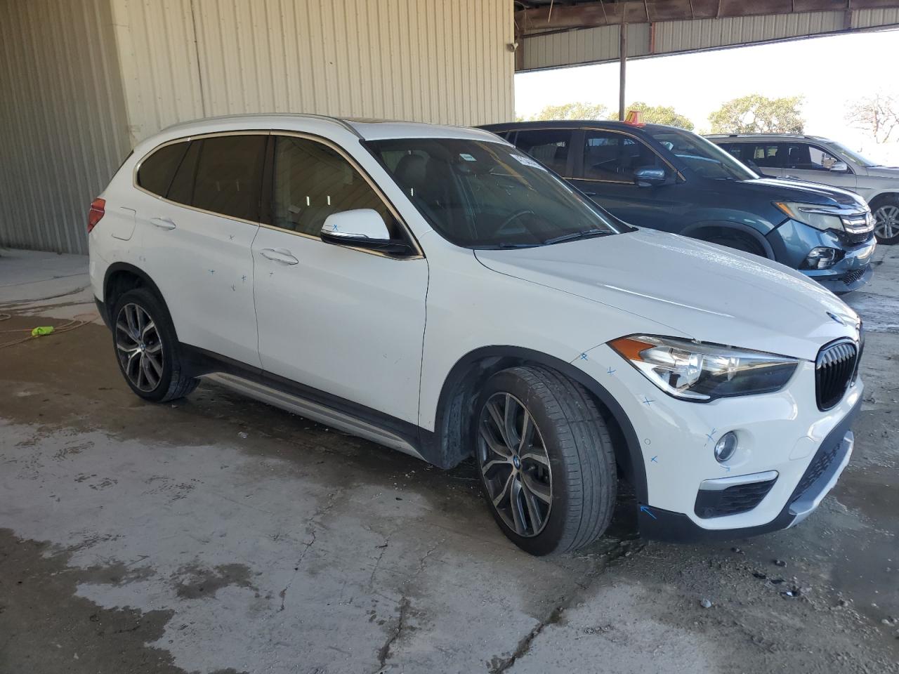 2018 BMW X1 VIN WBXHU7C34J5L08947 Copart auction photo, undercarriage damage thumbnail 4