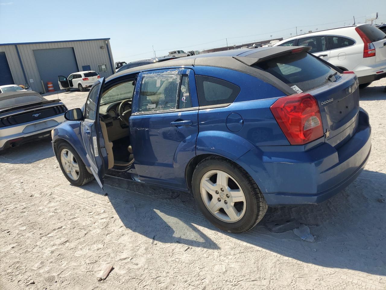 2009 Dodge Caliber VIN 1B3HB48A19D183899 Copart auction photo, side / front end damage thumbnail 2