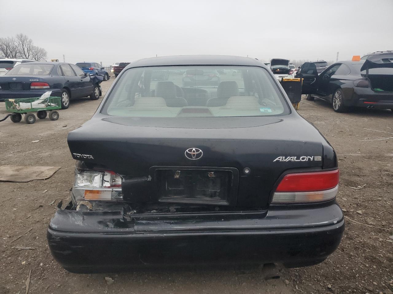 1997 Toyota Avalon VIN 4T1BF12B6VU210187 Copart auction photo, all over damage thumbnail 6