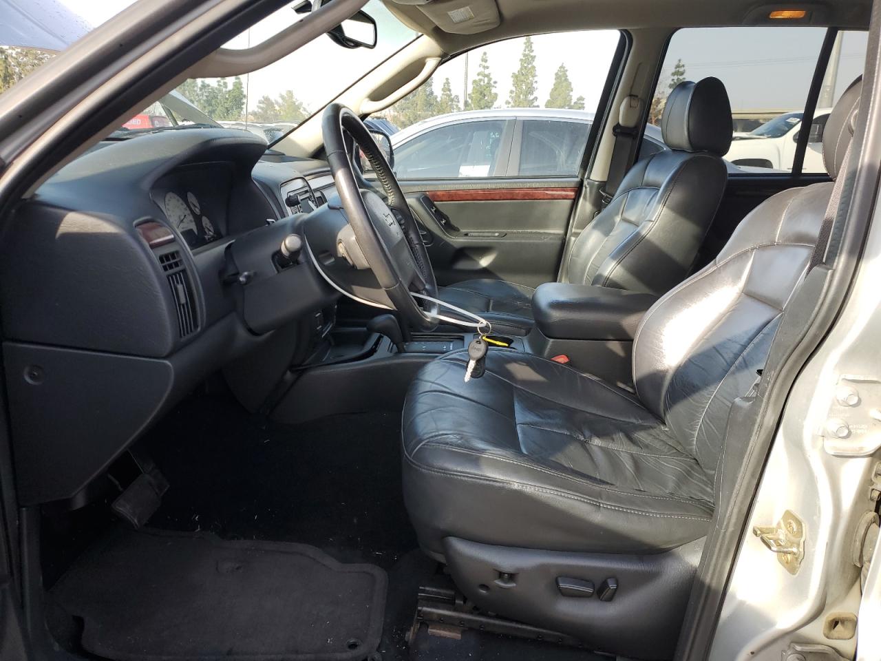 2004 Jeep Grand Cherokee VIN 1J4GW58J34C218987 Copart auction photo, side / undercarriage damage thumbnail 7