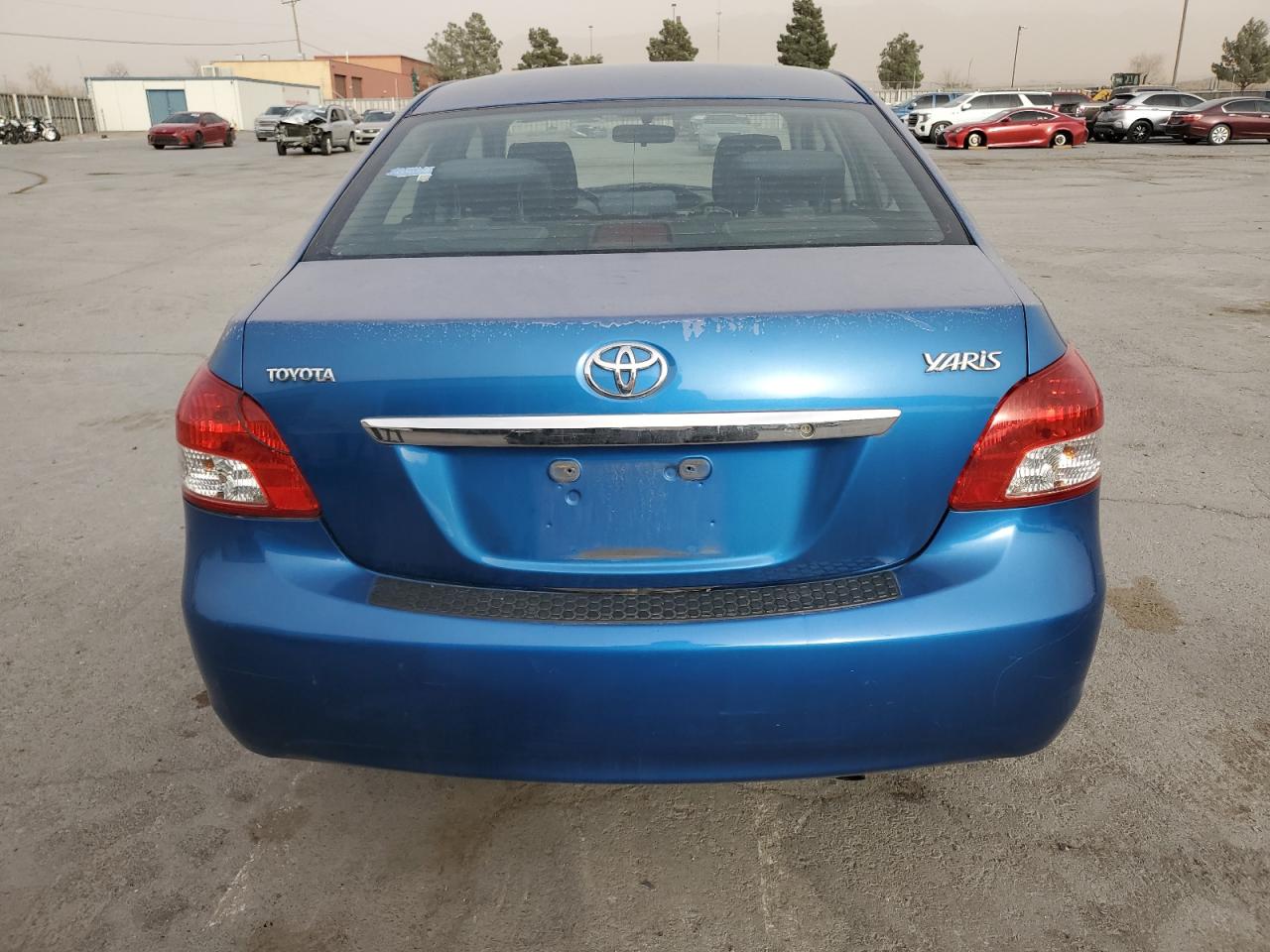 2009 Toyota Yaris VIN JTDBT903594045701 Copart auction photo, vandalism damage thumbnail 6
