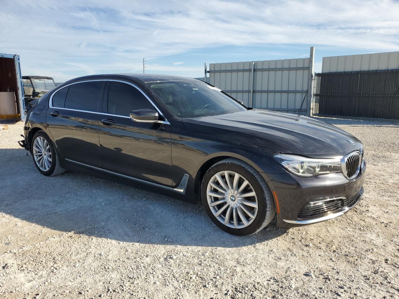 2016 BMW 7er VIN WBA7E2C56GG547064 Copart auction photo, rear end damage thumbnail 4