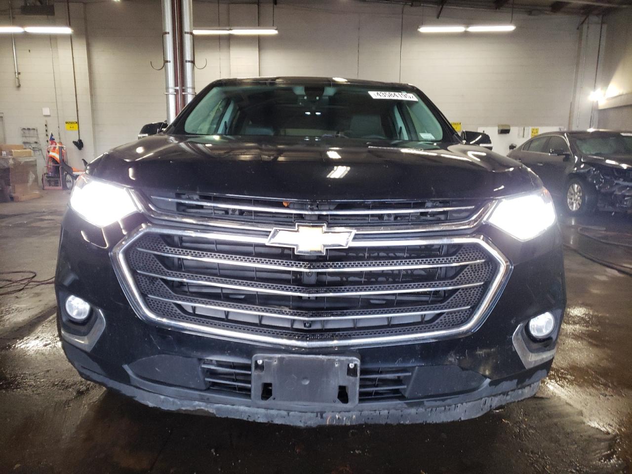 2018 Chevrolet Traverse VIN 1GNEVHKW7JJ159334 Copart auction photo, rear end / minor dent/scratches damage thumbnail 5