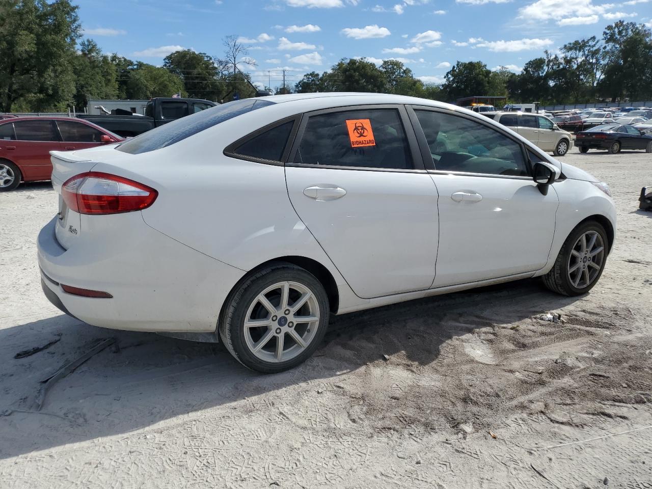 2019 Ford Fiesta VIN 3FADP4BJXKM123563 Copart auction photo, side / rear end damage thumbnail 3