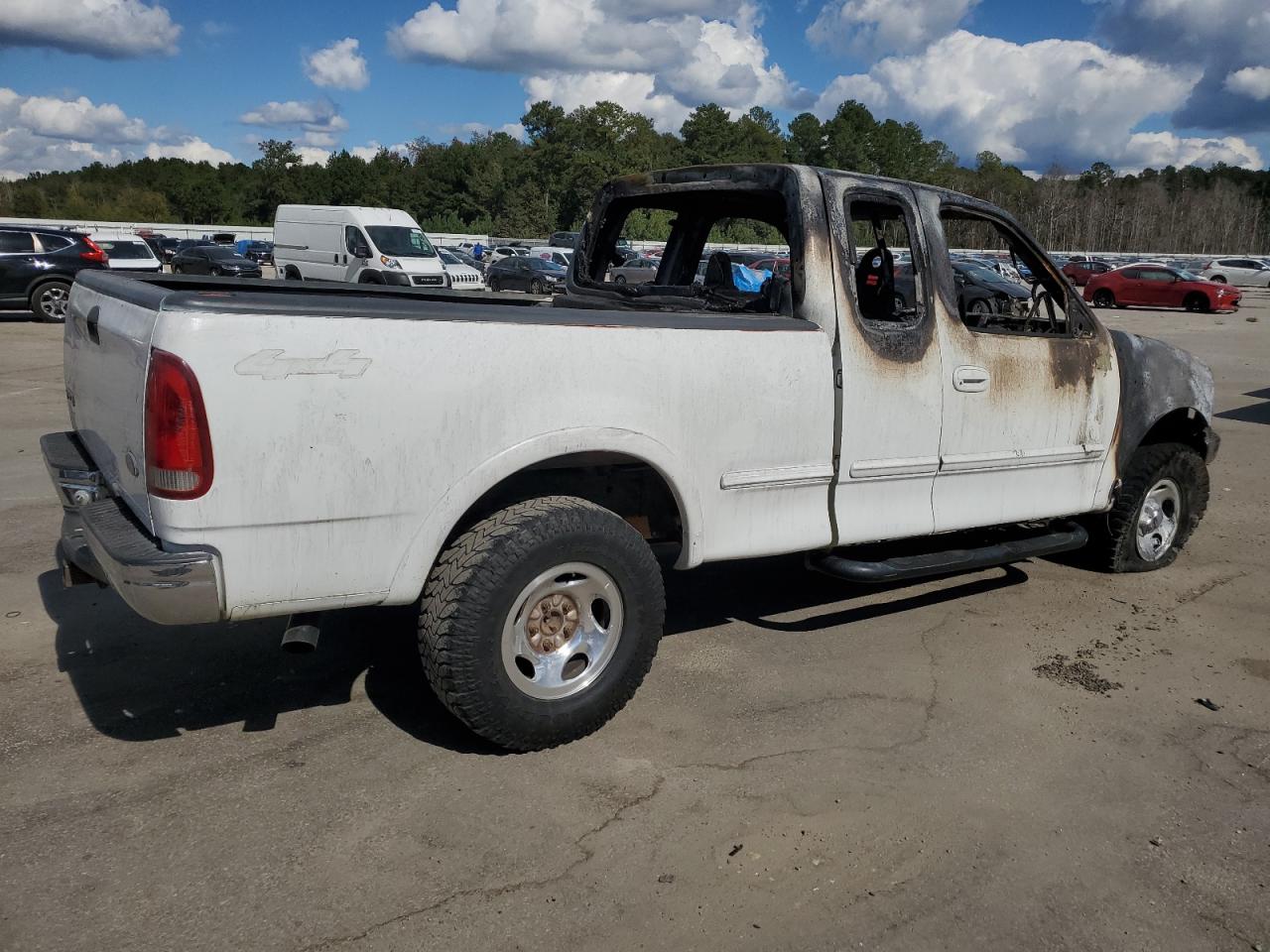 1999 Ford F-150 VIN 1FTRX18L8XNB11044 Copart auction photo, burn damage thumbnail 3