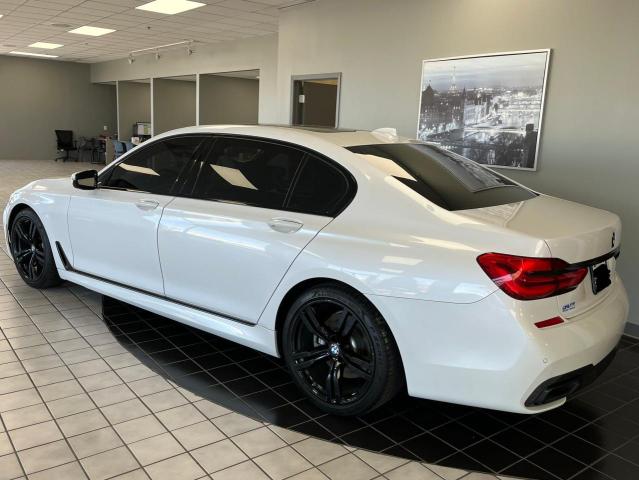 2018 BMW 7er VIN WBA7E2C50JG743251 Copart auction photo, minor dent/scratches / normal wear damage thumbnail 3