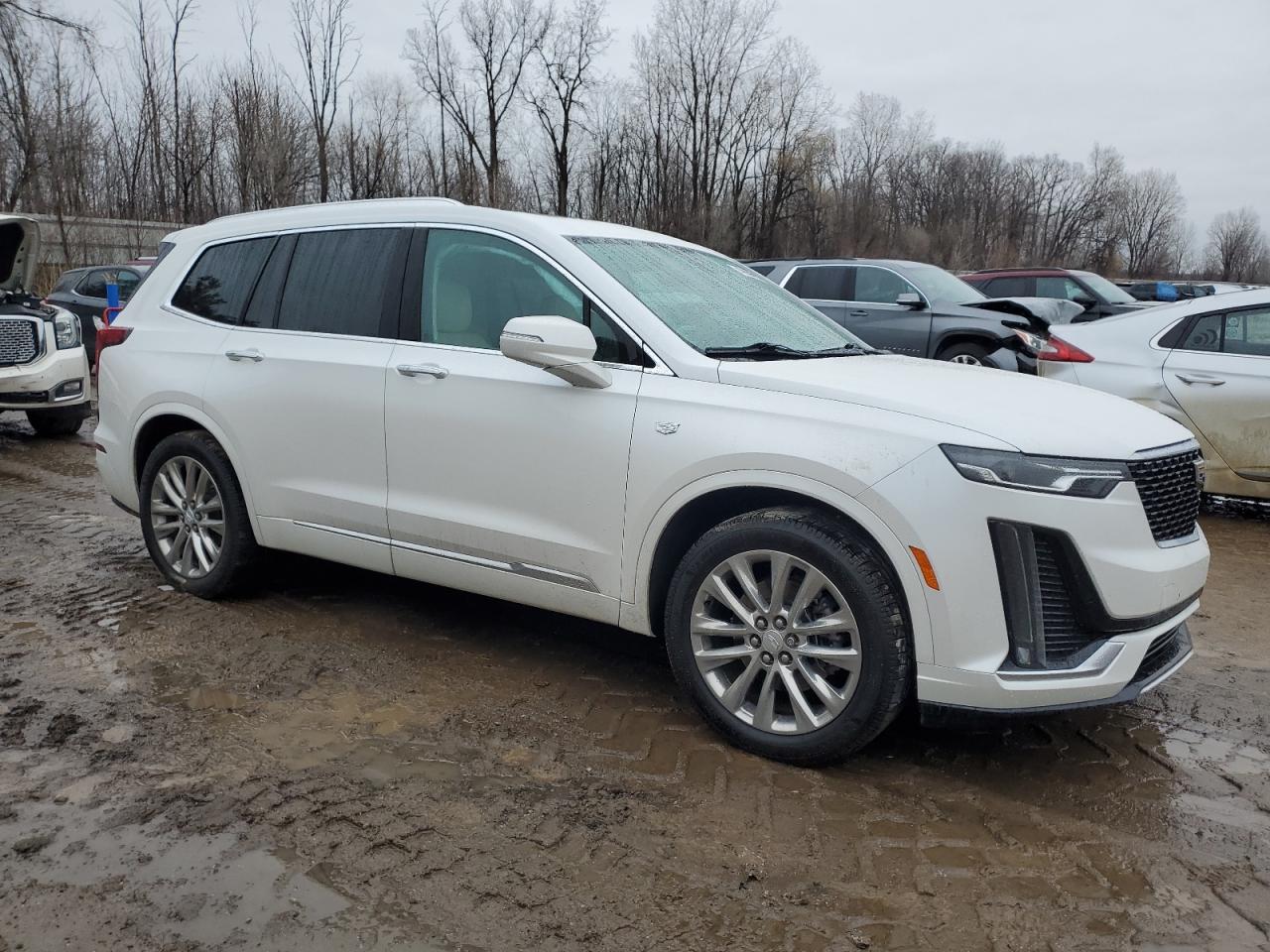 2021 Cadillac XT6 VIN 1GYKPDRS3MZ149692 Copart auction photo, side / rear end damage thumbnail 4