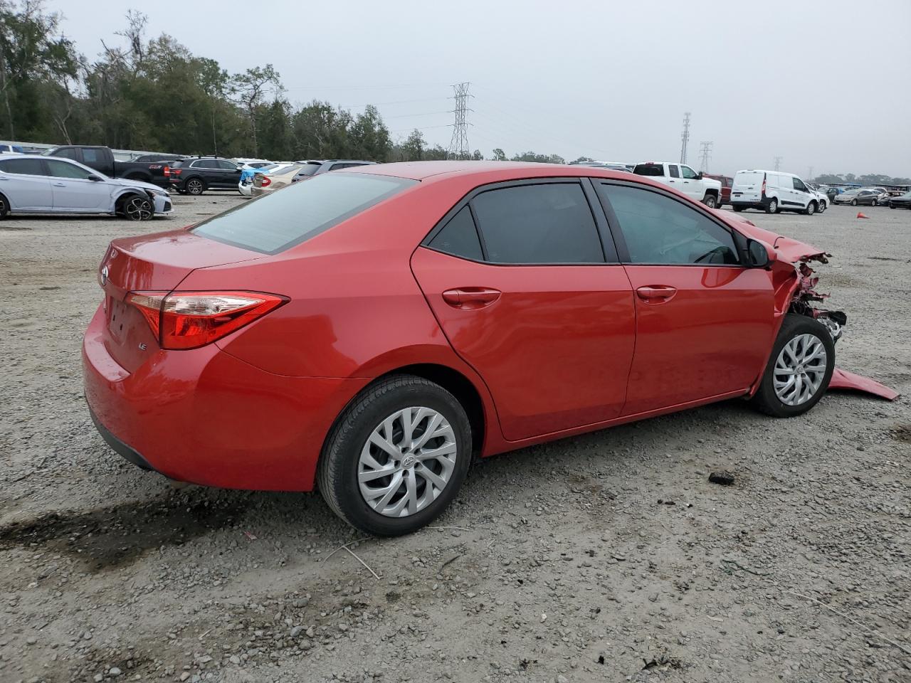 2018 Toyota Corolla VIN 5YFBURHE0JP799738 Copart auction photo, front end / side damage thumbnail 3