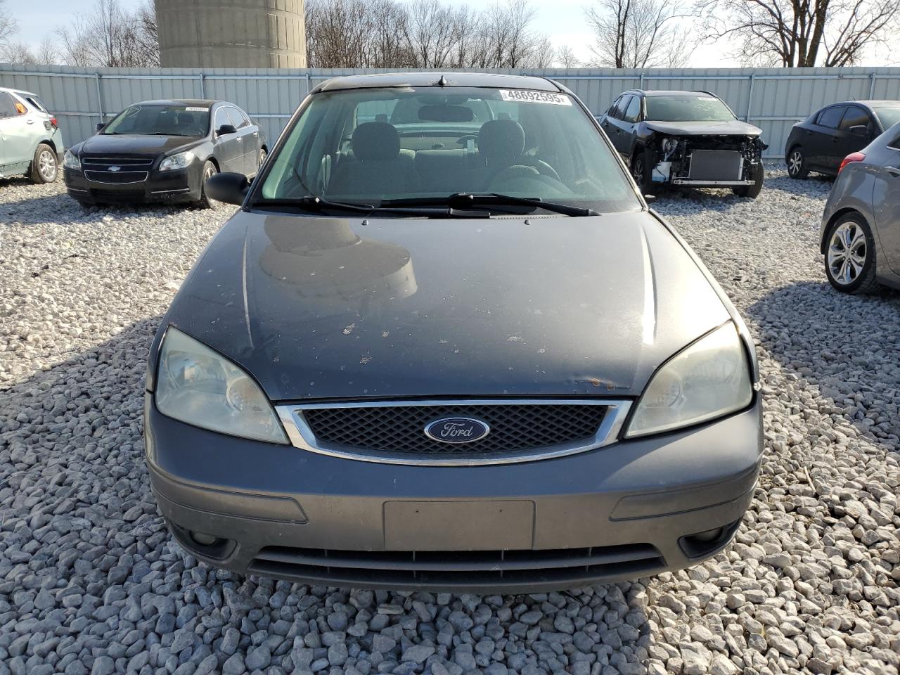 2007 Ford Focus VIN 1FAHP34N27W327339 Copart auction photo, all over damage thumbnail 5
