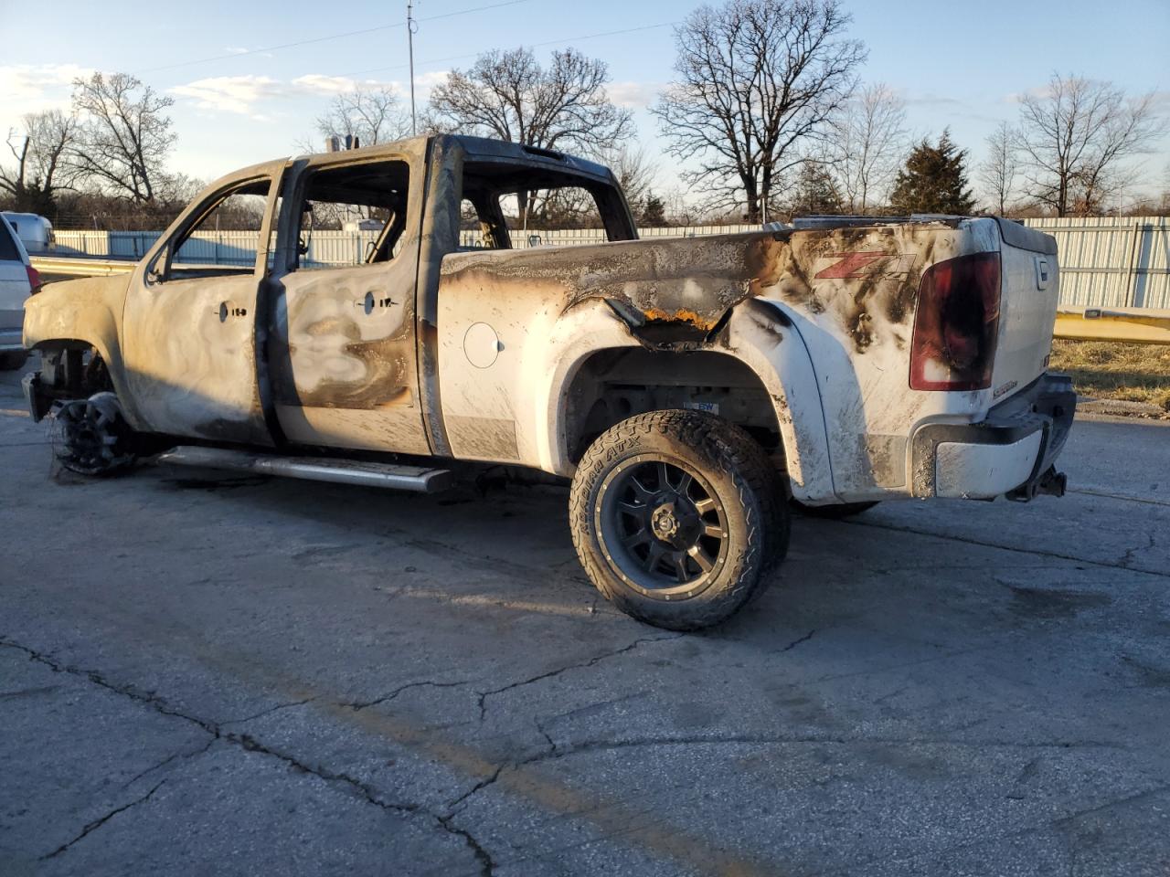 2011 GMC Sierra VIN 1GT121C80BF188282 Copart auction photo, burn damage thumbnail 2