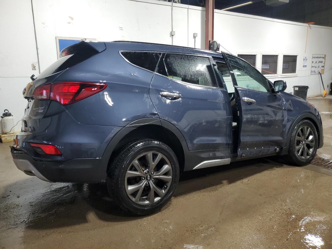 2017 Hyundai Santa Fe VIN 5XYZWDLA2HG486799 Copart auction photo, all over damage thumbnail 3