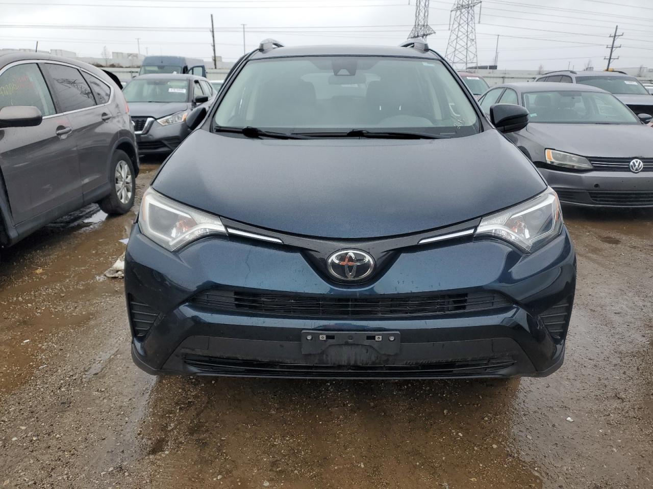 2018 Toyota RAV 4 VIN JTMZFREV1JJ180289 Copart auction photo, front end / side damage thumbnail 5