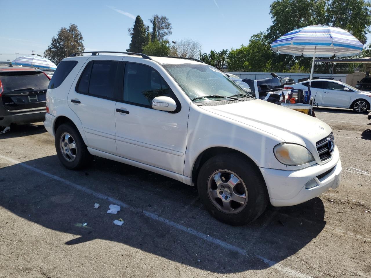 2002 Mercedes-Benz M-klasse VIN 4JGAB54E12A318056 Copart auction photo, side / minor dent/scratches damage thumbnail 4