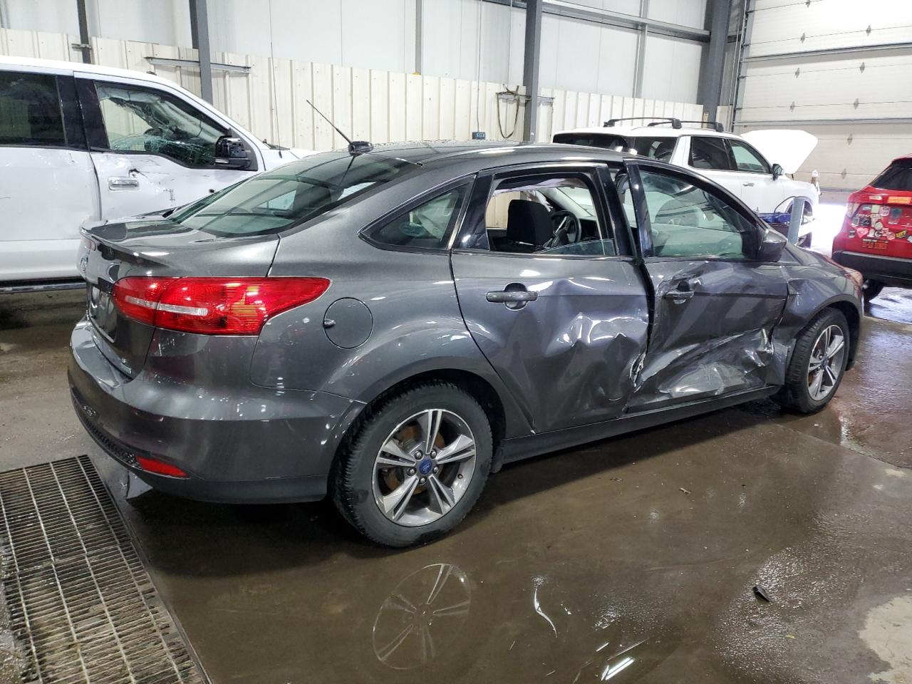 2018 Ford Focus VIN 1FADP3FE5JL244587 Copart auction photo, side damage thumbnail 3